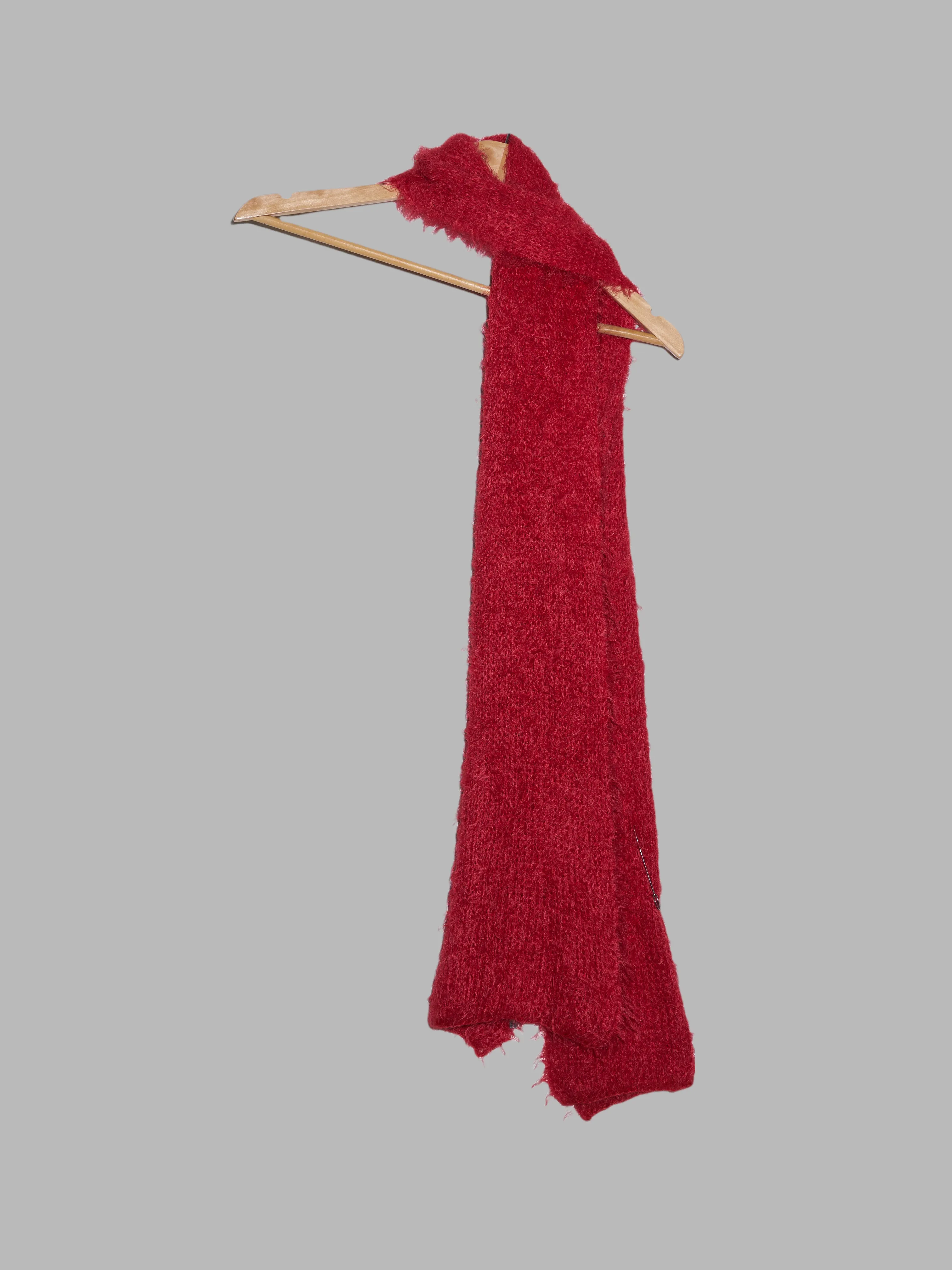 Jean Colonna red mohair-y scarf with safety pin