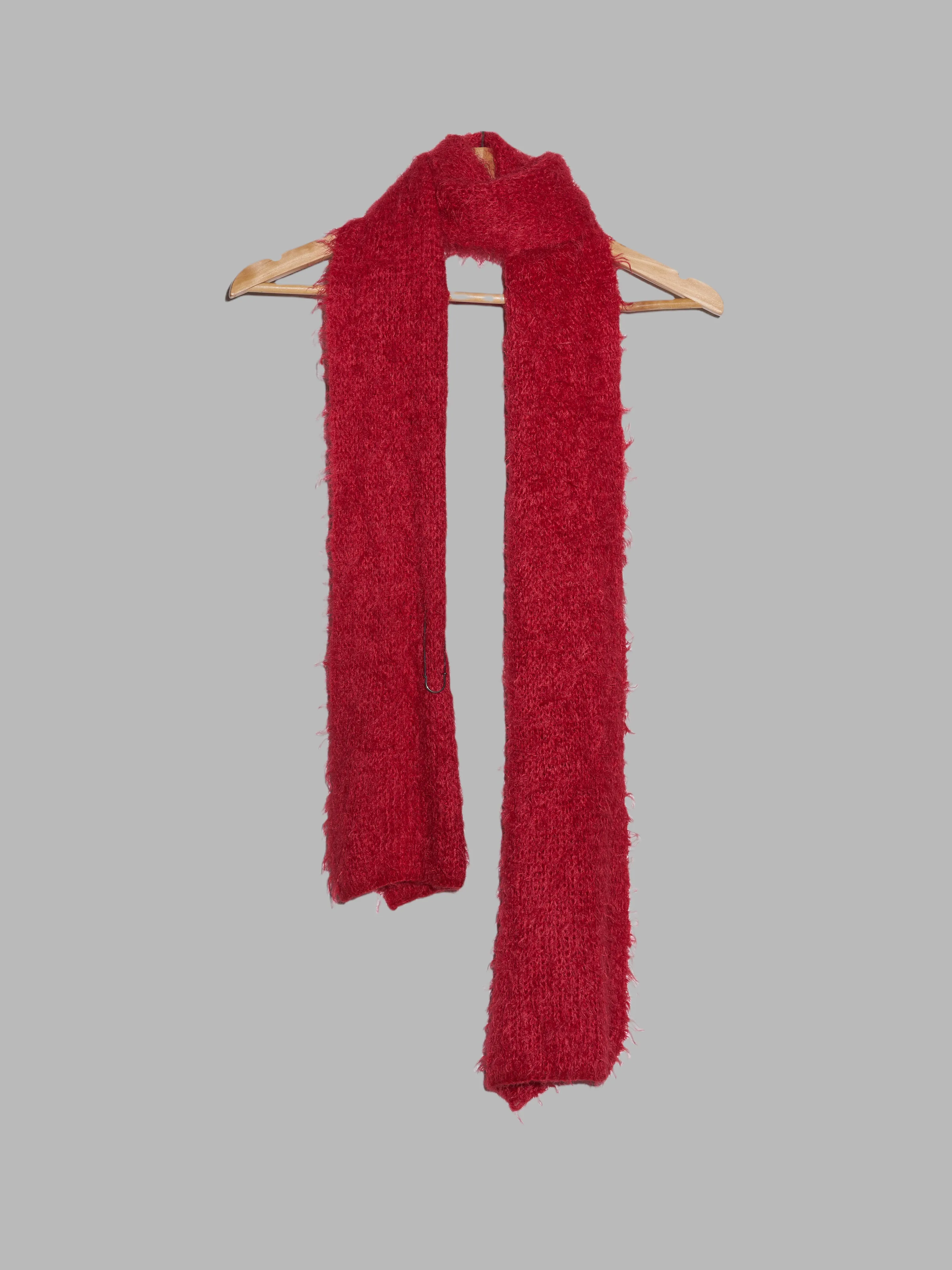 Jean Colonna red mohair-y scarf with safety pin
